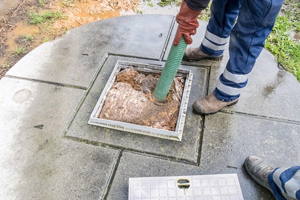 signs that you need cesspool pumping include slow draining sinks and toilets, foul odors, and pooling water around the septic system